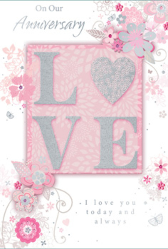 An anniversary card is shown in soft, flattering light, its design unfolding like a paper bouquet crafted with care by an Edgware florist who knows the language of romance. At its centre, the word LOVE stands proudly in raised, glitter-touched letters that give the surface a luxurious, tactile quality, similar to running your fingers over the intricate petals of a fully opened rose. The glitter, in delicate silver tones, catches the light with a subtle shimmer rather than a harsh shine, making the letters seem almost frosted. Behind them lies a blush-pink panel that glows gently, as if capturing the warmth of a sunset over local gardens and parks. Around this central word, a halo of stylized flowers unfurls, each bloom rendered with fine, flowing lines and soft shading in pink, white, and pale grey. The blossoms and leaves curl and loop in graceful arcs, resembling the natural sweep of stems in a curated bouquet waiting for delivery to a home near Burnt Oak or Queensbury. Wispy tendrils and swirling filigree shapes add a feeling of lightness, like petals drifting on a passing breeze. Small details-tiny leaves, delicate veins, and subtle variations in tone-suggest the attentive hand of someone used to studying real flowers up close. An understated, script-style message weaves through the design, offering loving anniversary wishes without overshadowing the artwork. Altogether, the card feels gentle and intimate, bringing to mind the quiet, heartfelt celebrations that follow a surprise delivery of soft pink blooms, carefully arranged and sent to honour a lasting relationship in Edgware.